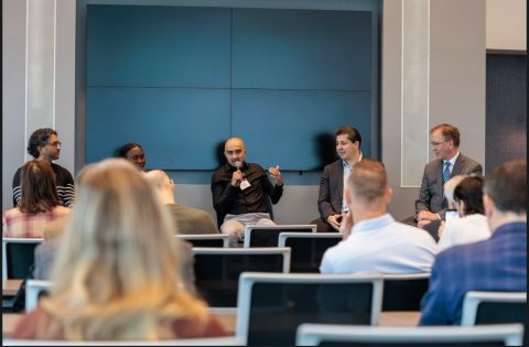Sagar participating in a panel with other experts